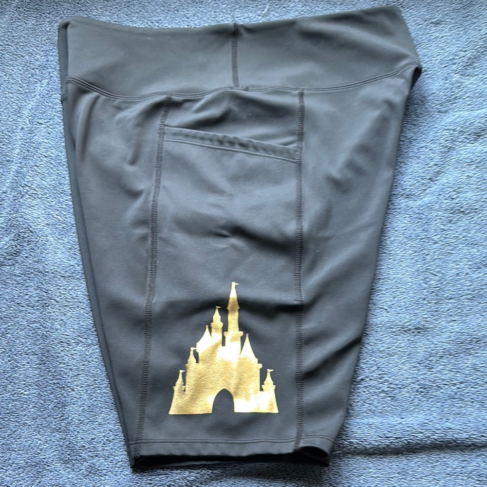 Disney Black yoga shorts with gold emblem Pre Owned